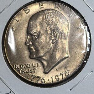 1976-D Bicentennial Eisenhower Dollar.. Mint State... AU.. In Protective Holder